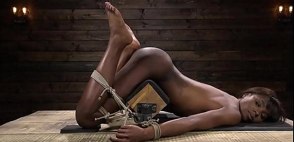  Gagged tied ebony slut is whipped
